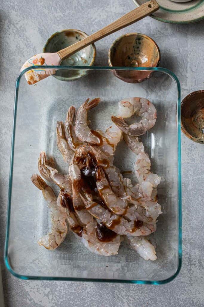 marinated shrimp in a glass container.