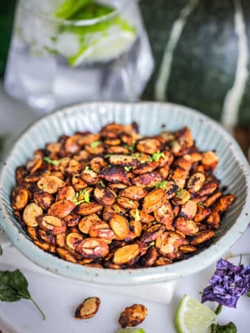 roasted Kabocha Squash seeds on a small bowl.