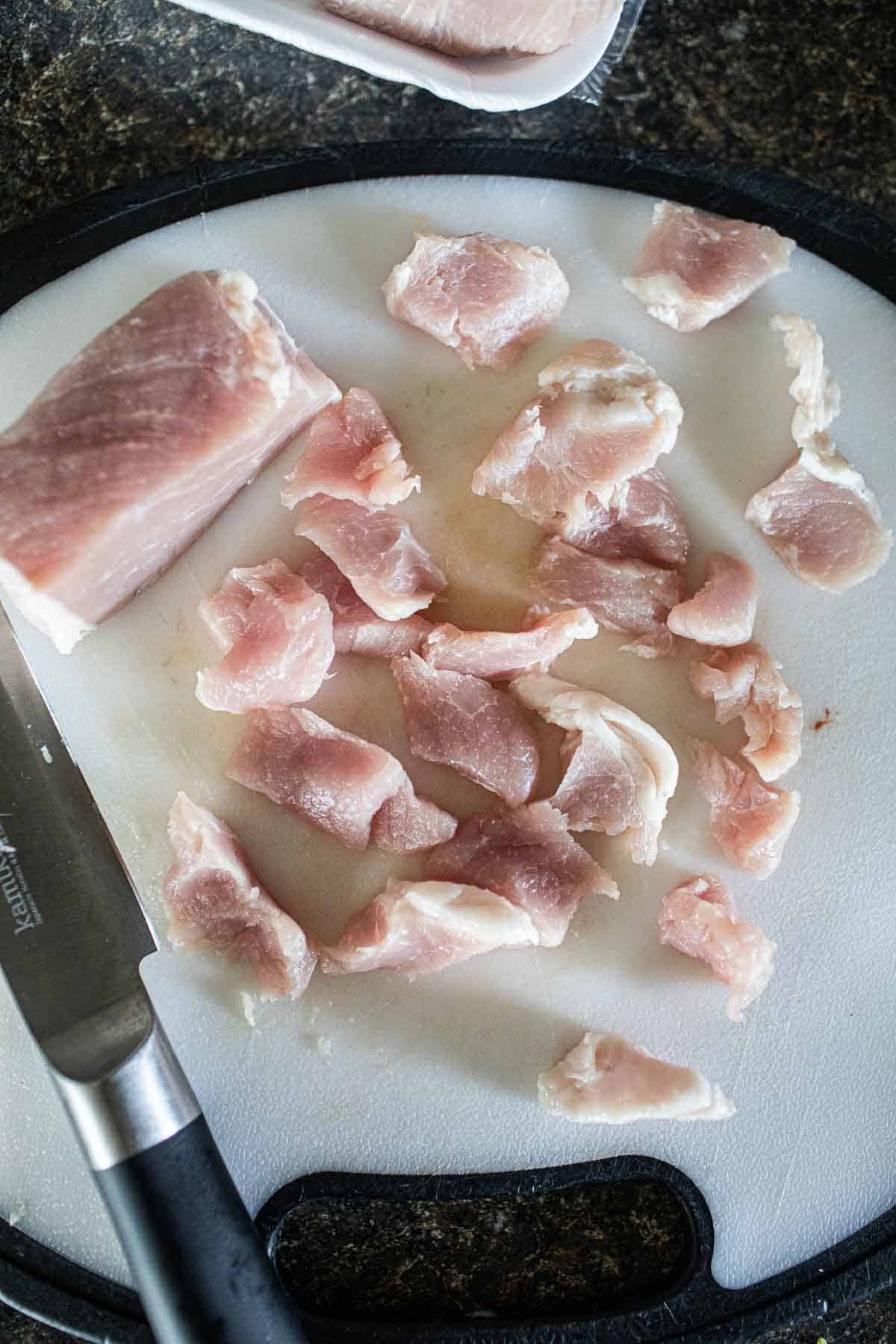 sliced pork on a cutting board.  