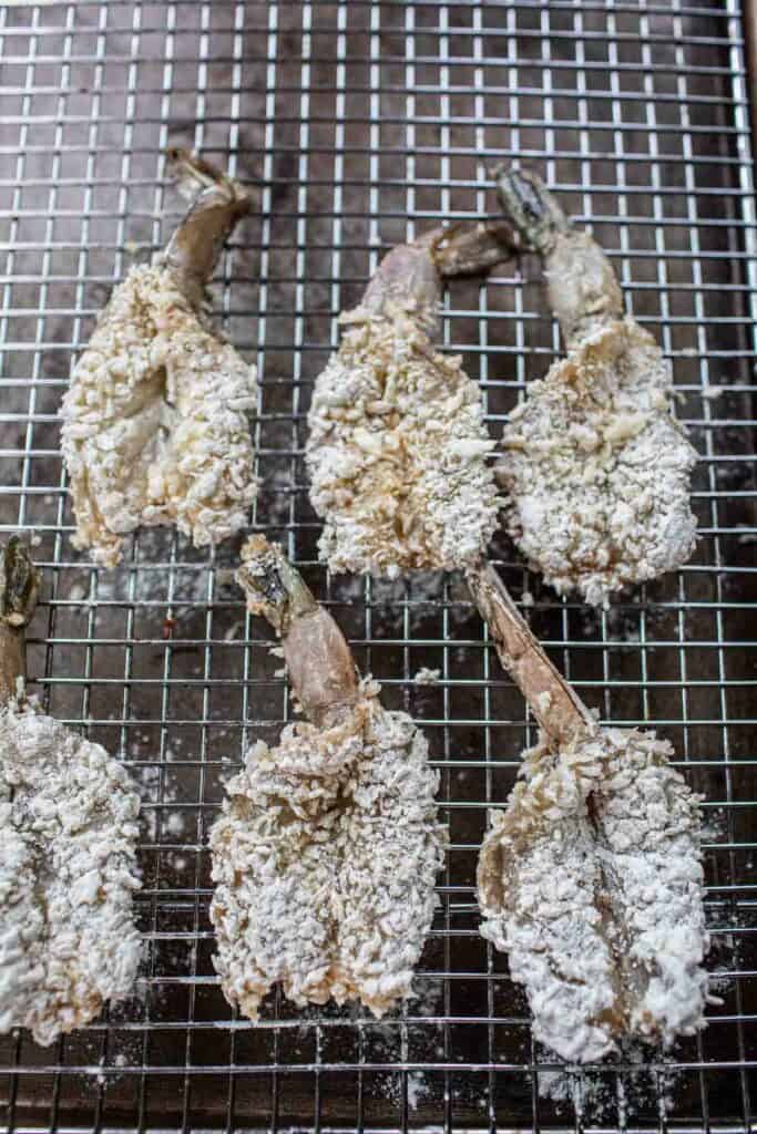 breaded shrimp on a rack. 