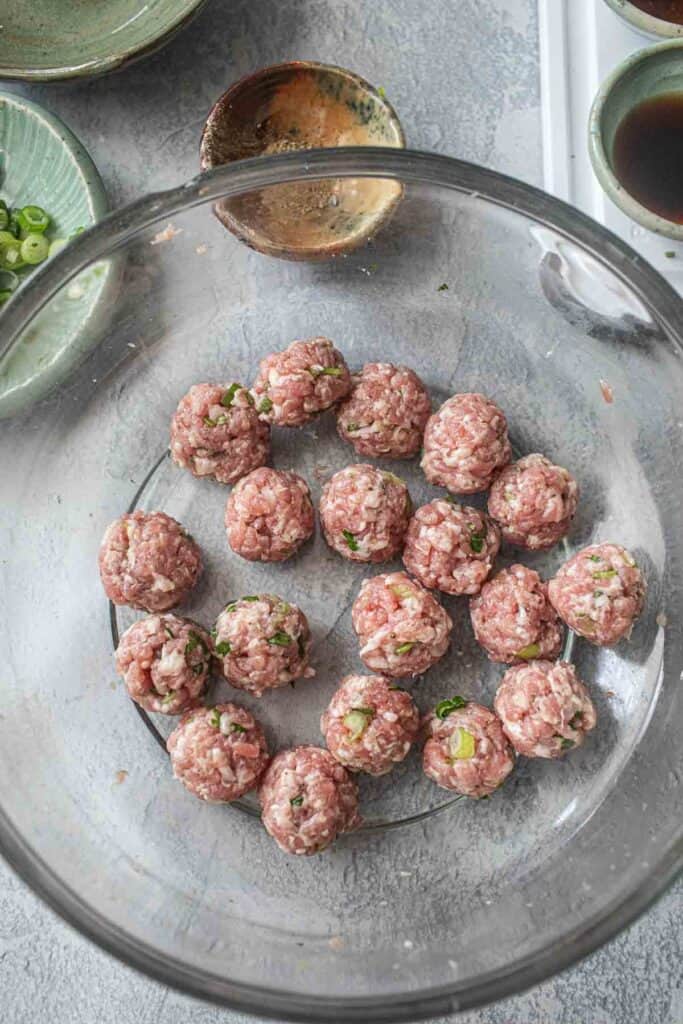 Pork meatballs in a glass bowl. 