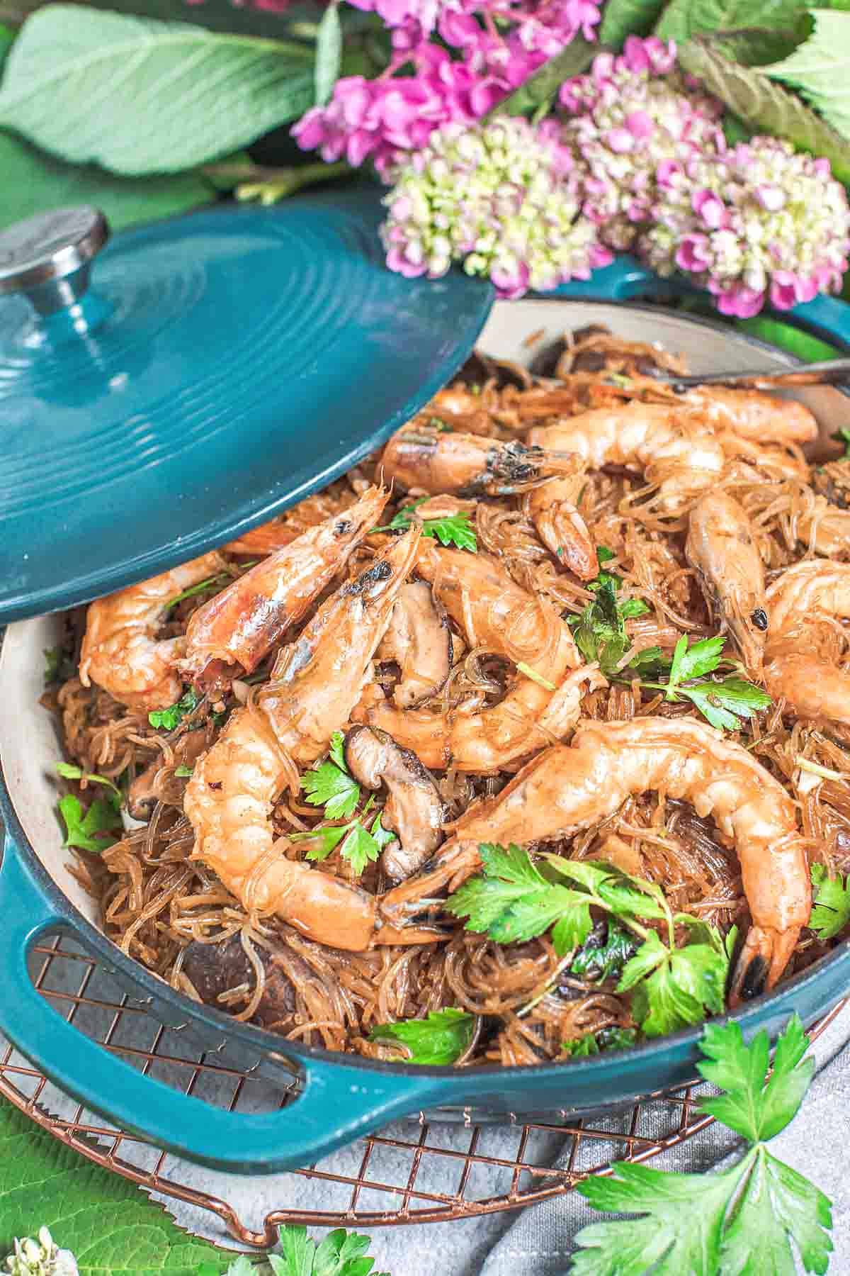 Thai Glass Noodle with shrimp on a table with lid.