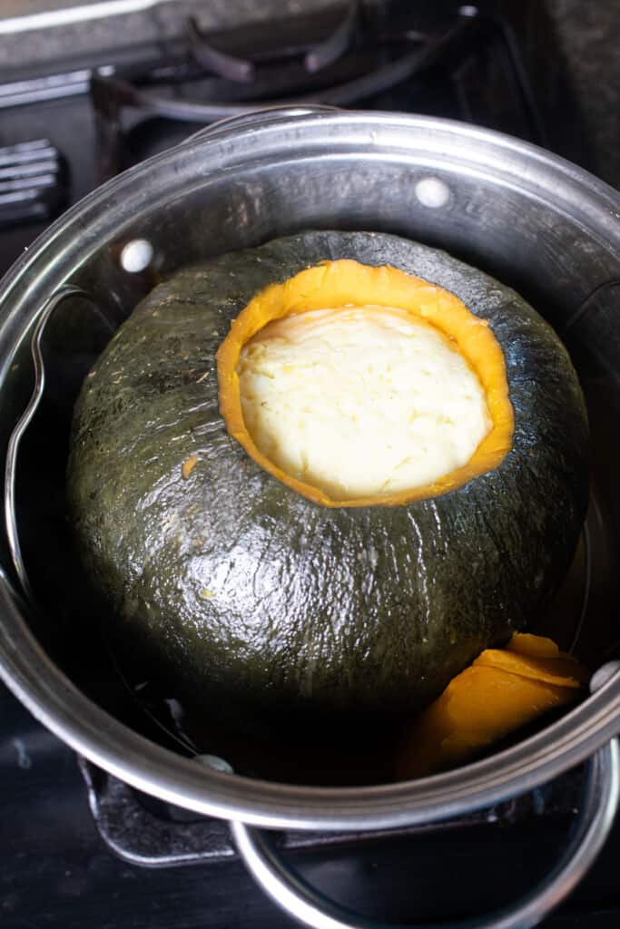 Thai steamed sankaya fak tong custard in a steaming pot. 