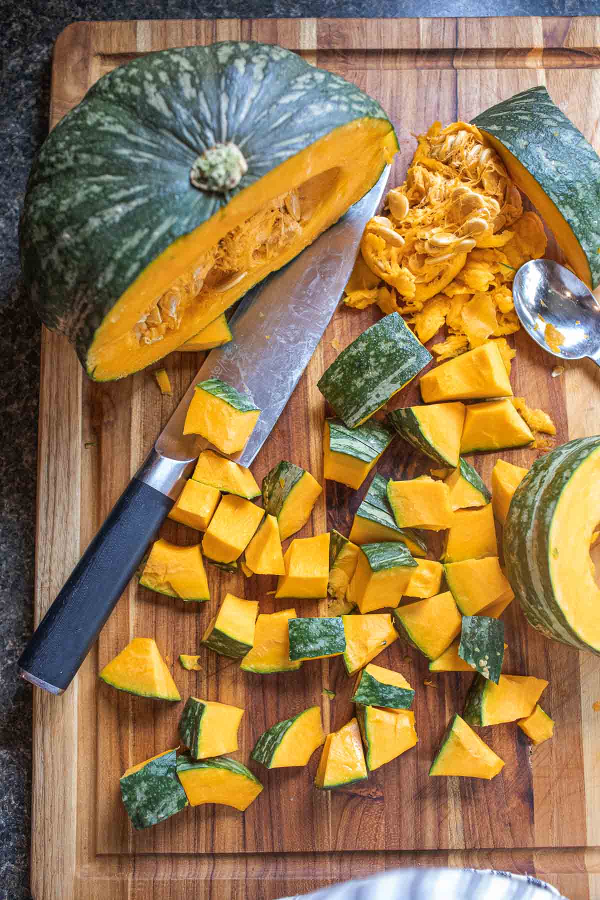 Sliced Kabocha squash on a cutting board. 