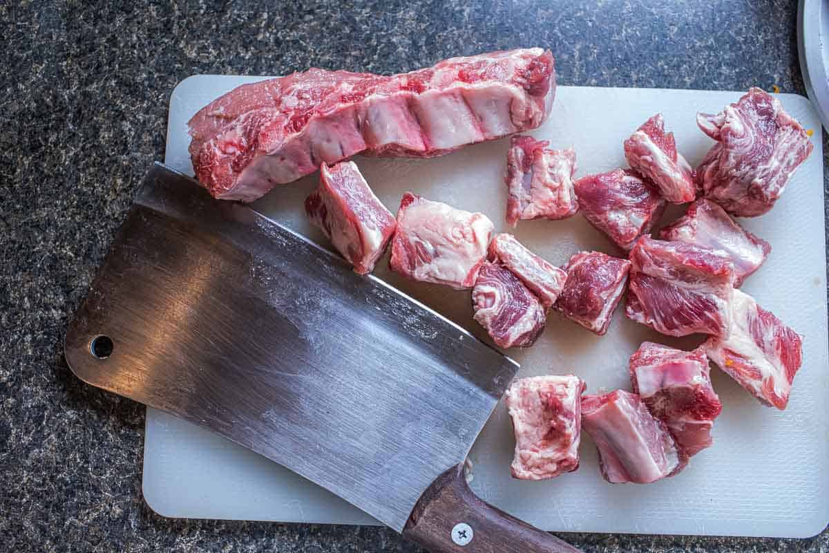 baby pork ribs on a cutting board.