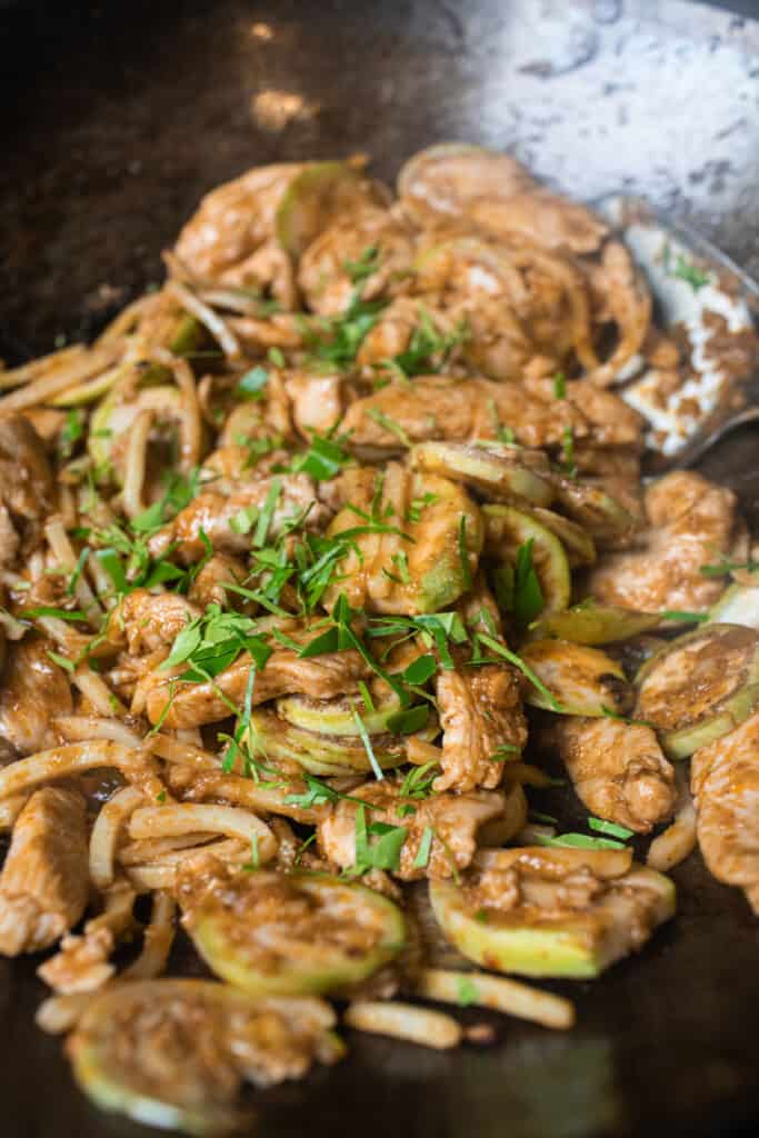 kaffir leaves with chicken in a wok. 