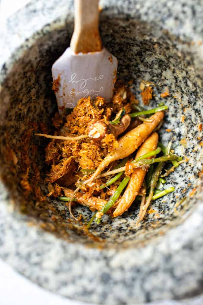 Jungle curry paste with herbs in a mortar. 