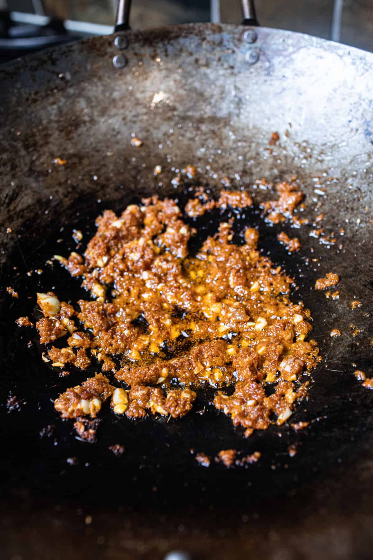 Curry paste frying in a wok. 