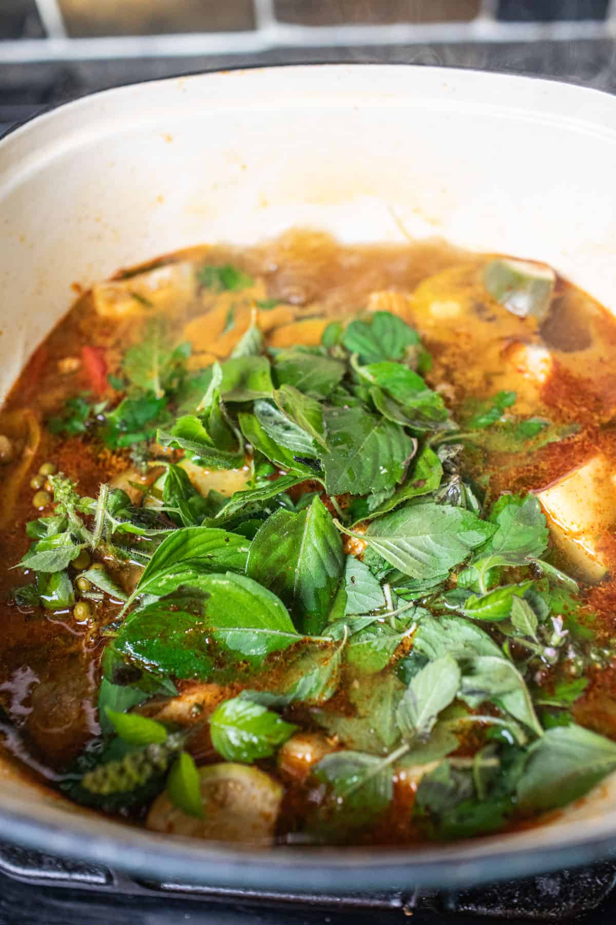 Basil in a pot of jungle curry. 