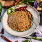 jungle curry paste in a bowl with a spoon.