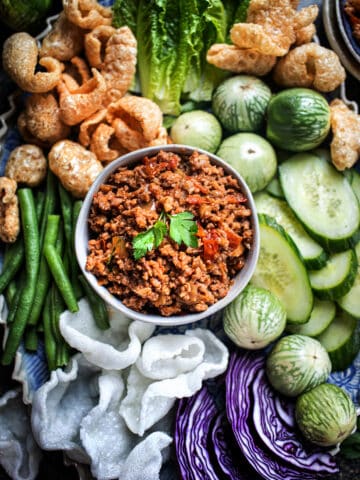 authentic nam prik ong dip in a bowl with vegetables.