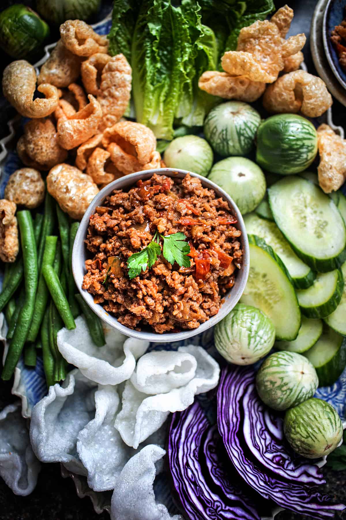 Nam Prik Ong Dip in a bowl with veggies around.