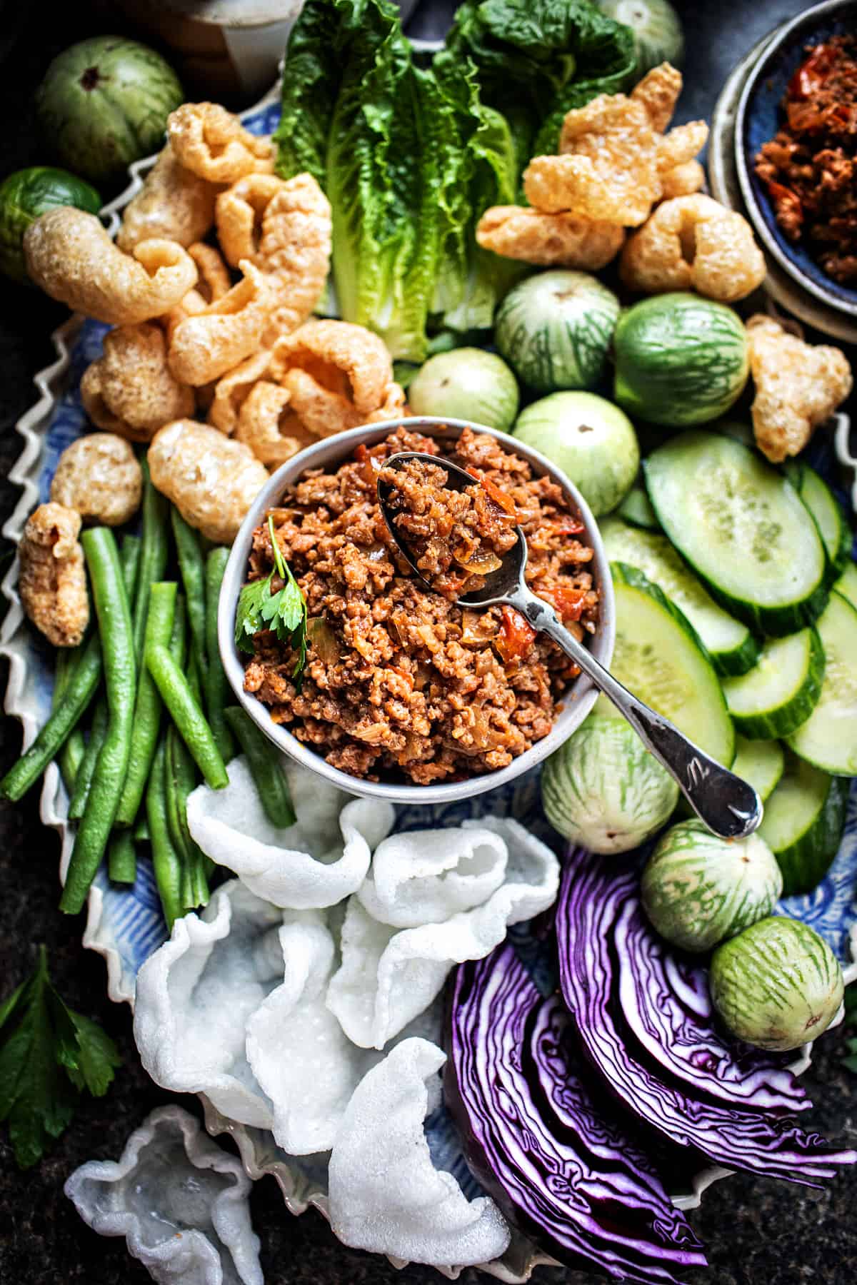 Nam prik ong dip with vegetables on a tray. 