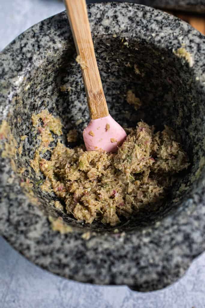Tom kha paste in a mortar and pestle. 