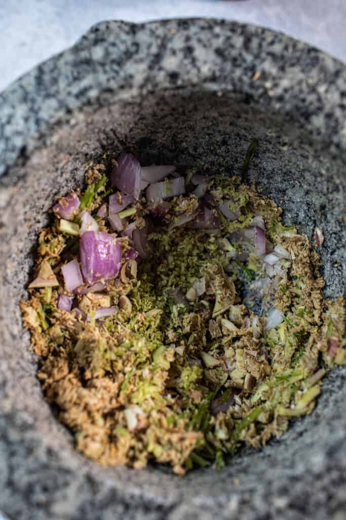 Ground herbs in a mortar.