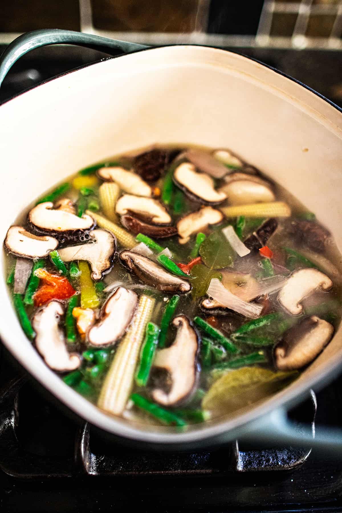 Vegetarian Thai soup in a pot on the stove. 