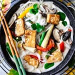 Vegetarian tom kha soup in a bowl on the table.