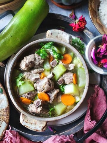 Winter melon soup in a bowl on the table.