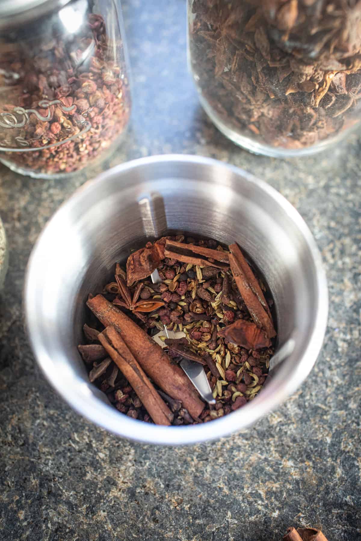 whole Five spice in a grinder. 