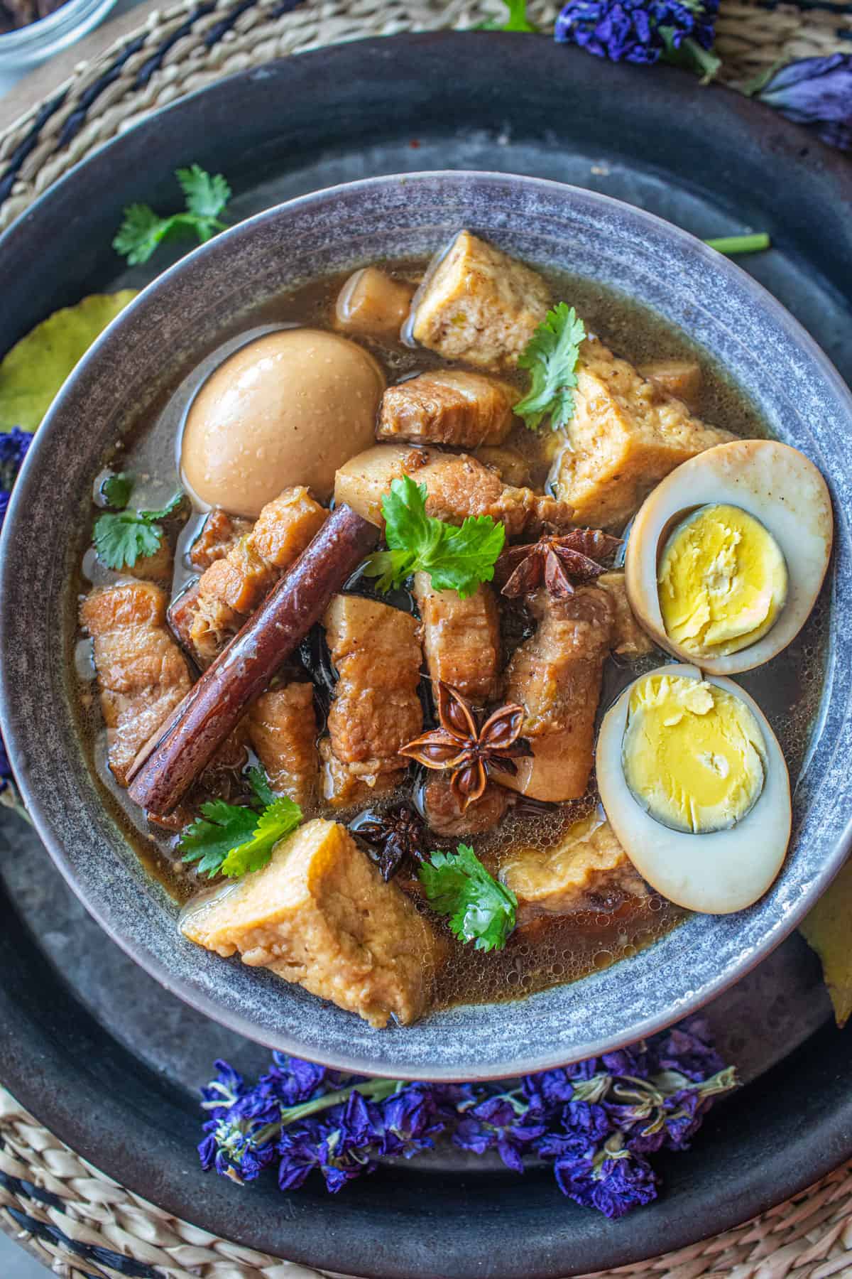 Moo Pa lo recipe in a bowl with eggs and spices.