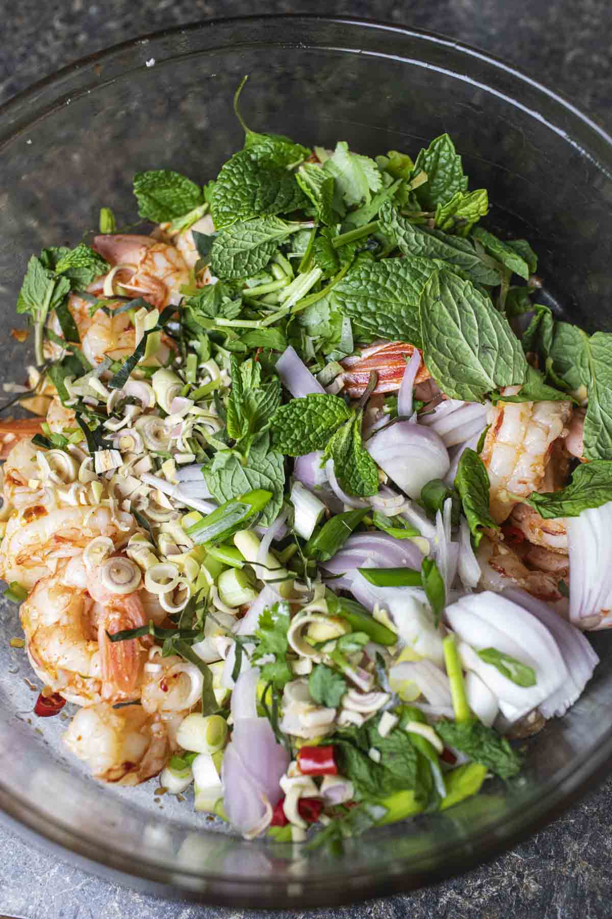 Thai prawn salad in a glass bowl. 