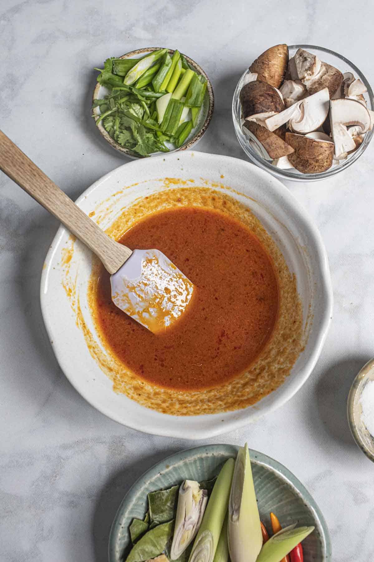 Tom Yum sauce for Stir fry Tom Yum Noodles in a bowl on a table.