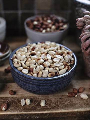 Thai dry roasted peanuts in a blue bowl.