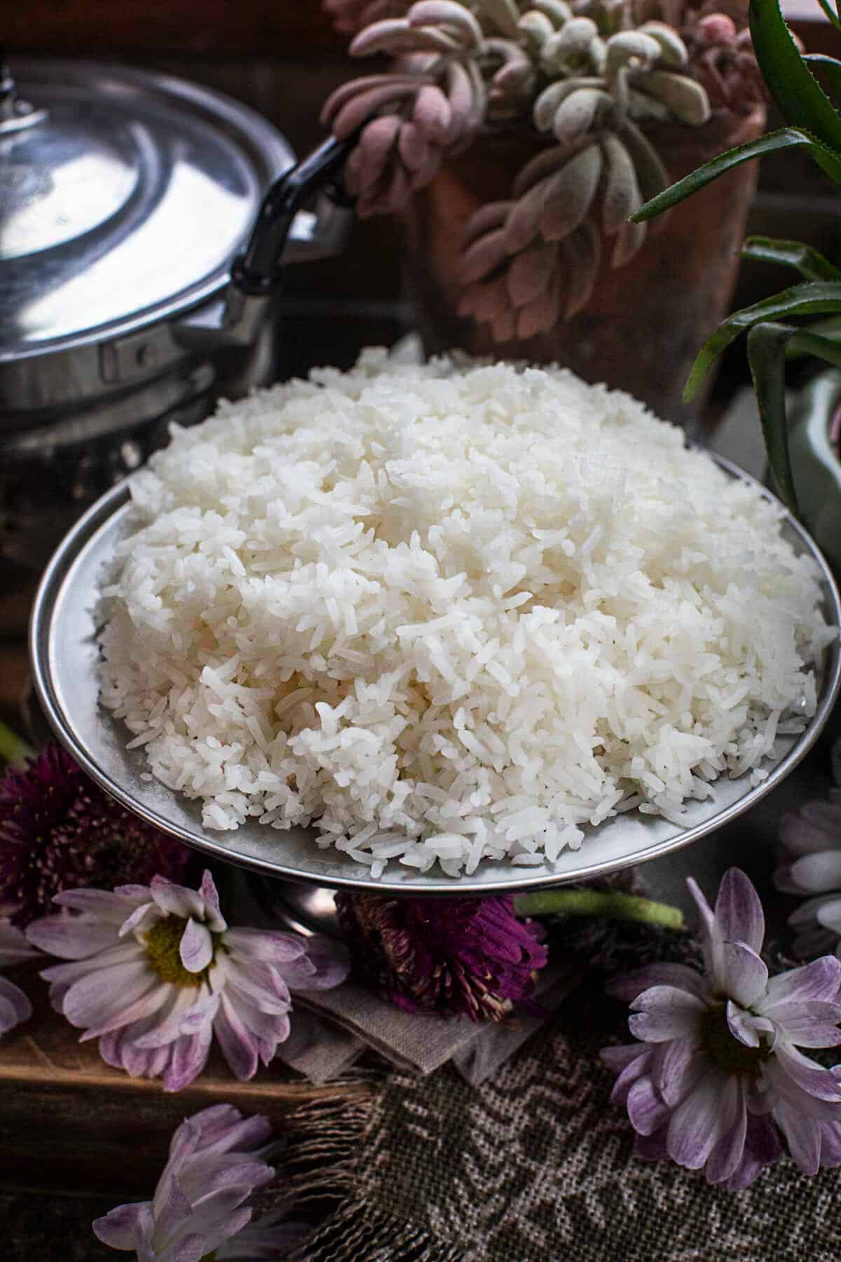 Cooked jasmine rice on a platter on the table. 