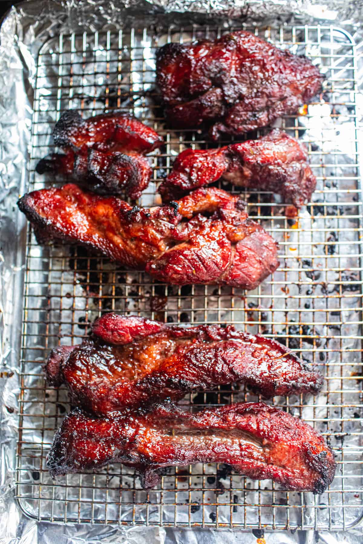 roasted red pork on a baking sheet.