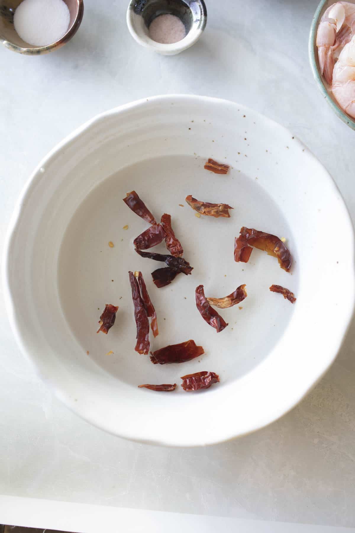 Soaking Dried red chili in water for paste.