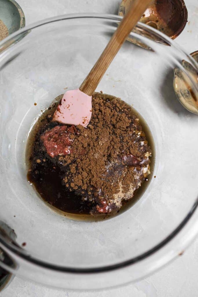 char siu marinade in a bowl with spatula. 