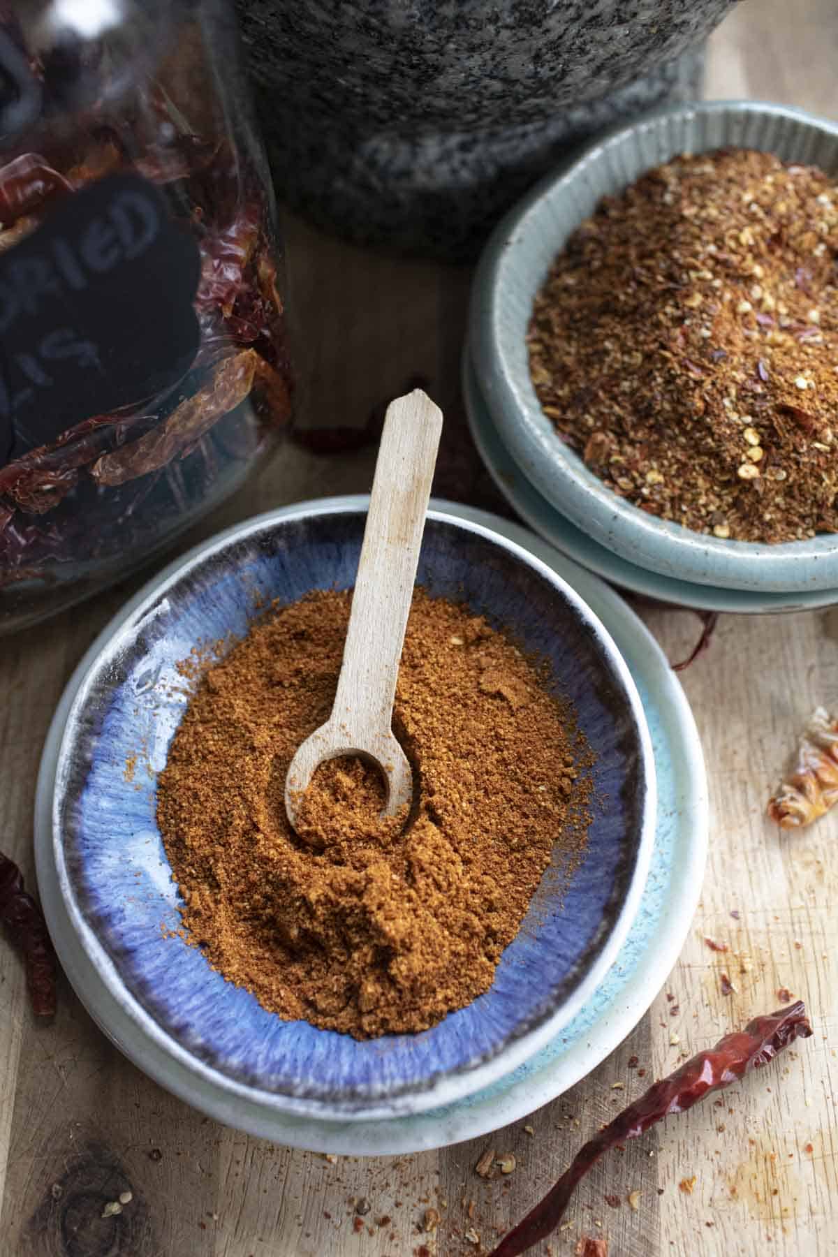 Thai Chili powder in a bowl with small spoon in the middle.
