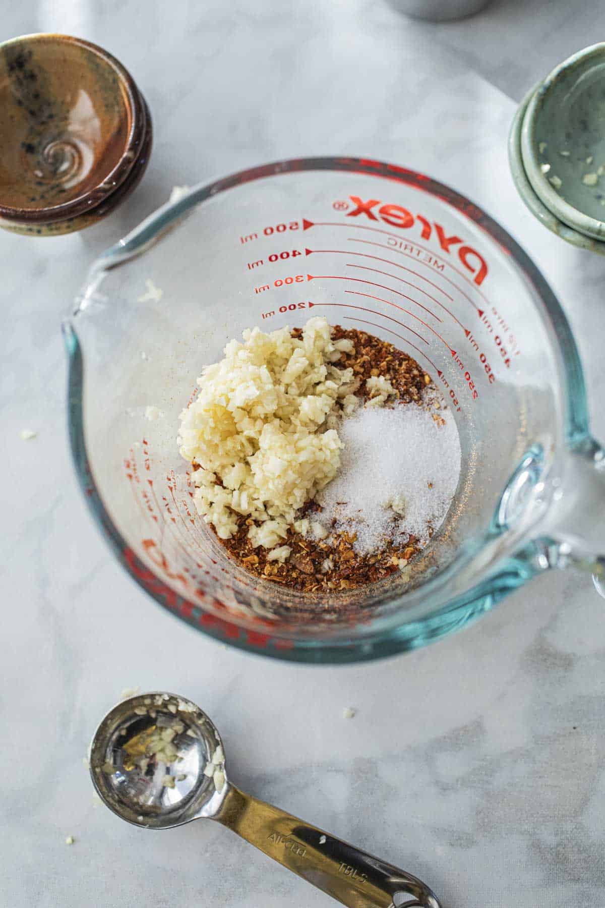 Thai Chili oil ingredients in a glass measuring cup.