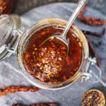 Thai chili oil in a glass jar.