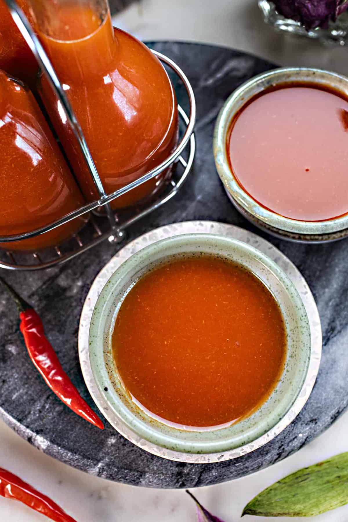 Thai hot sauce in a small bowl on the counter. 