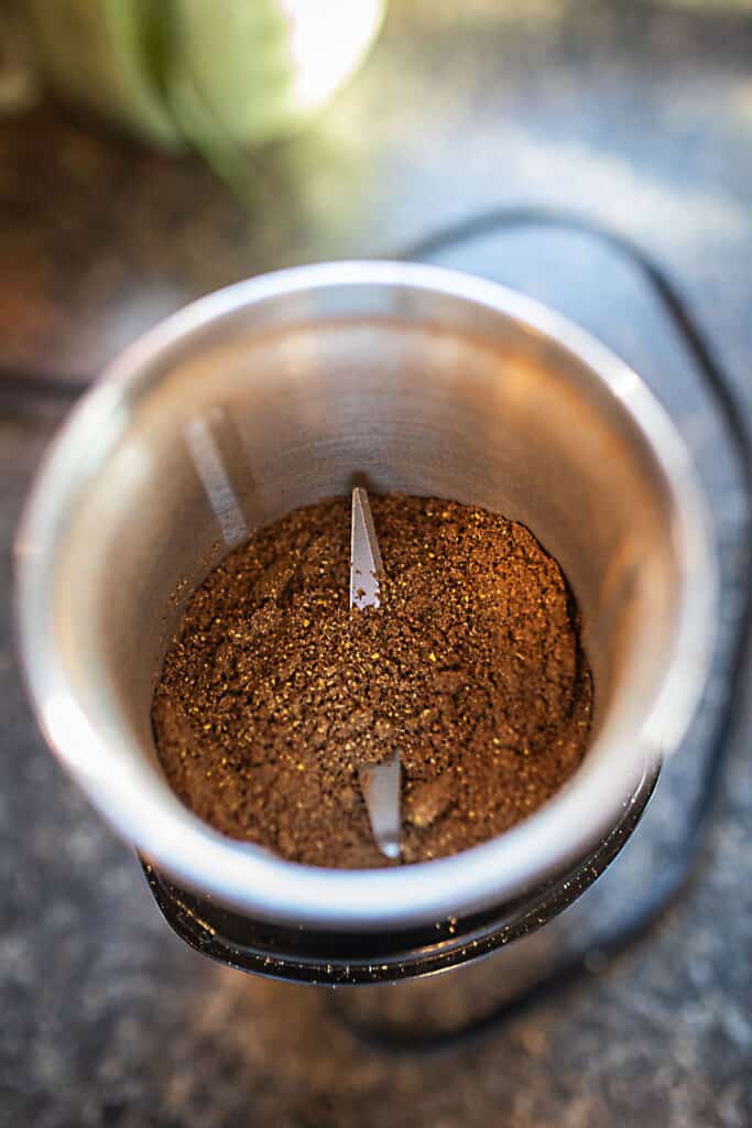 Spice powder inside a grinder.