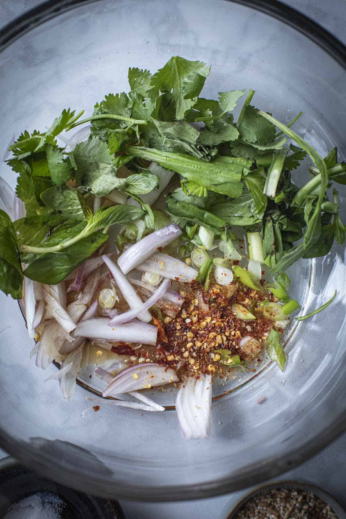 Herbs and veggies for waterfall salad in a bowl. 