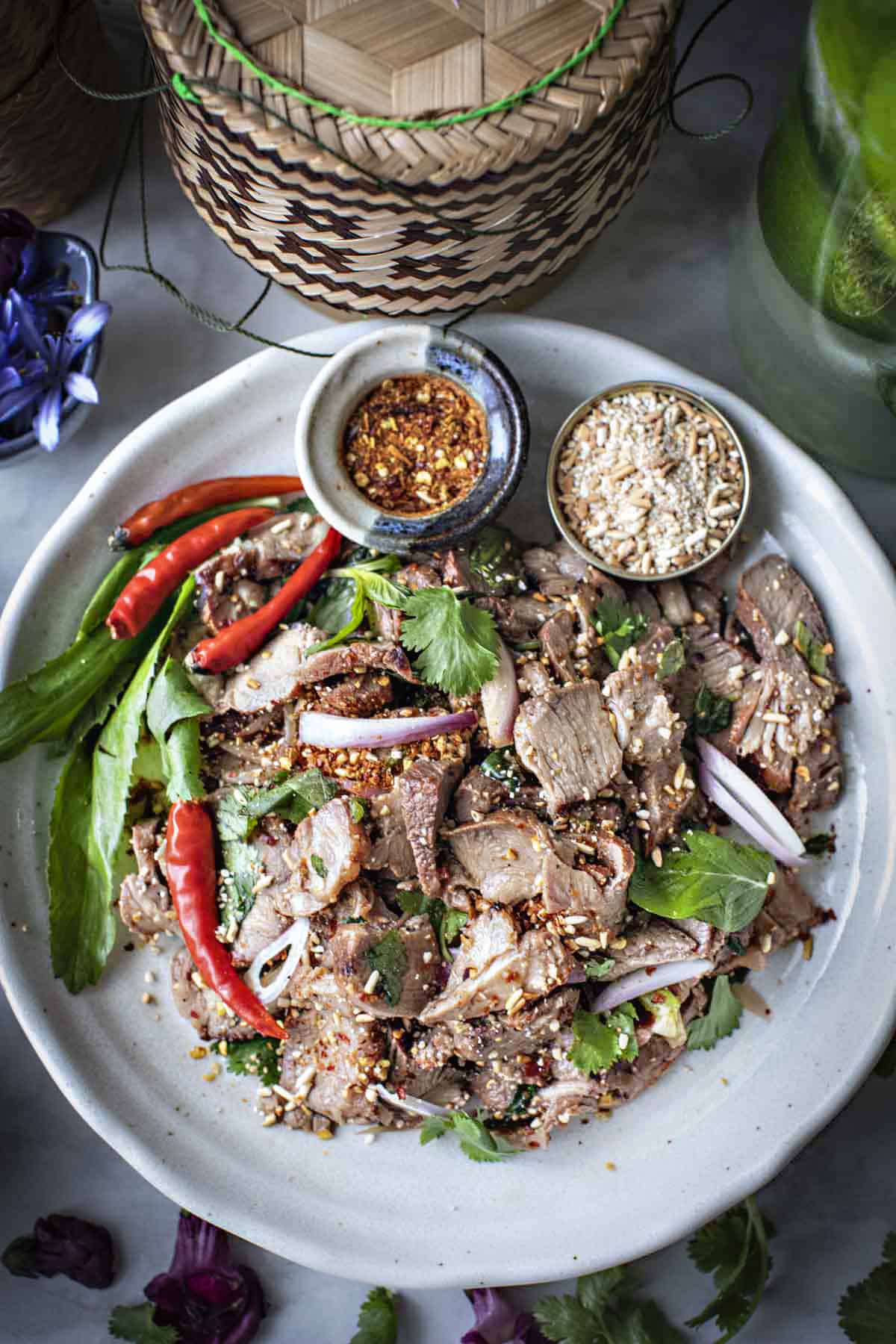 Thai grilled pork waterfall salad on a plate. 