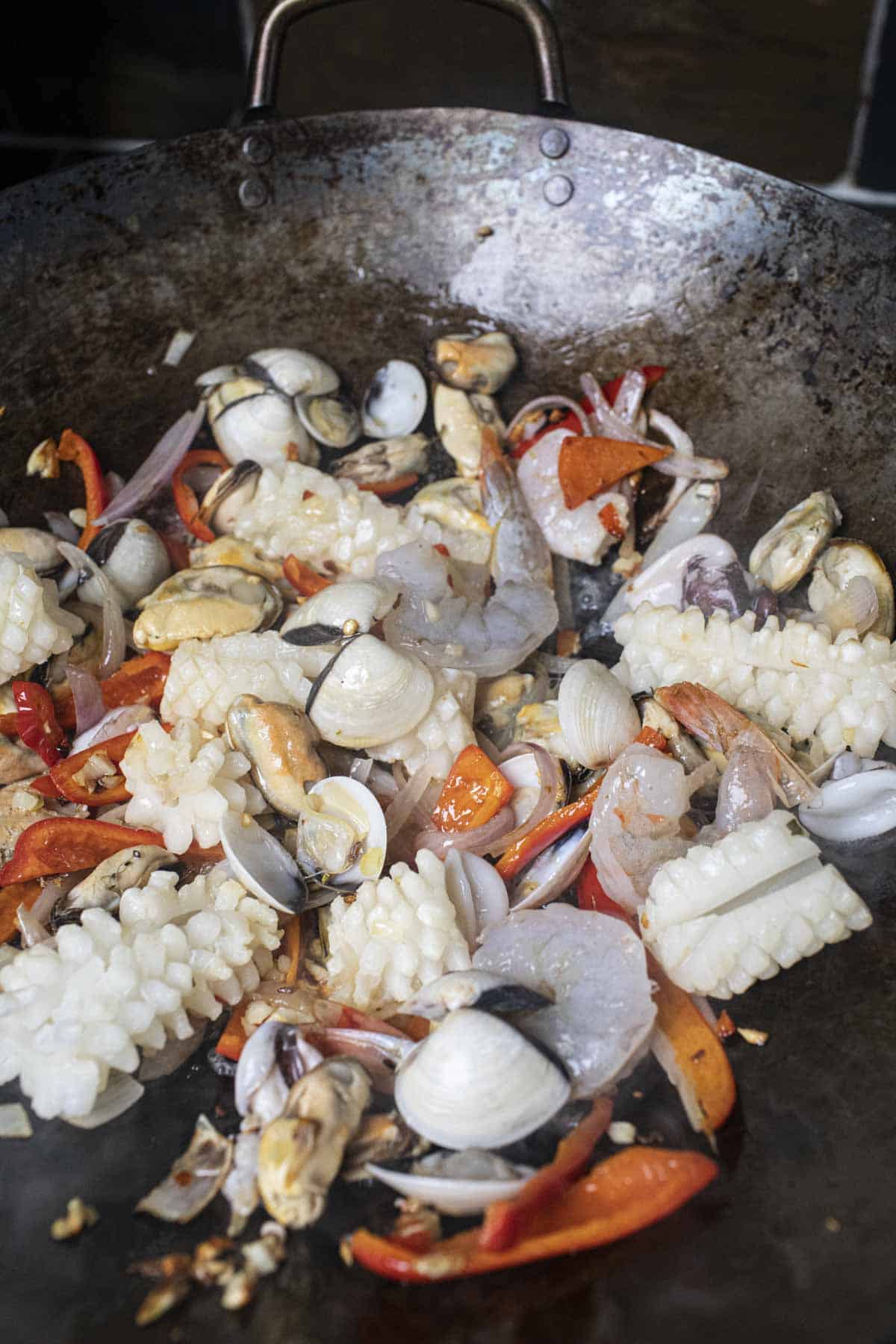 Seafood in a wok for stir frying. 