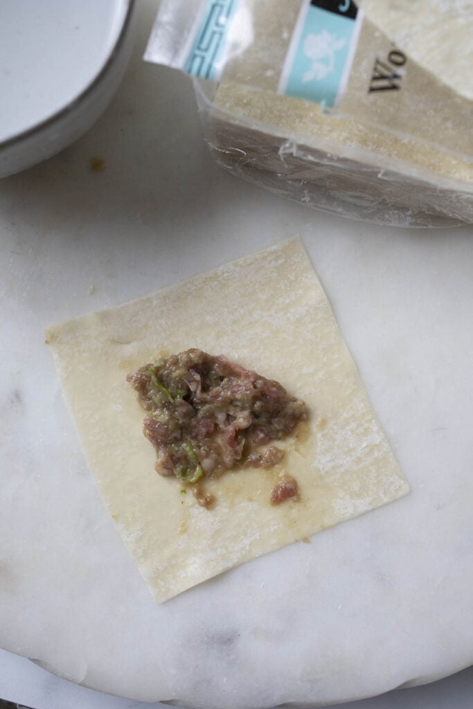 Beef filling on a wonton wrapper.