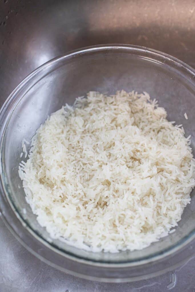 Rinsed rice in a glass bowl. 