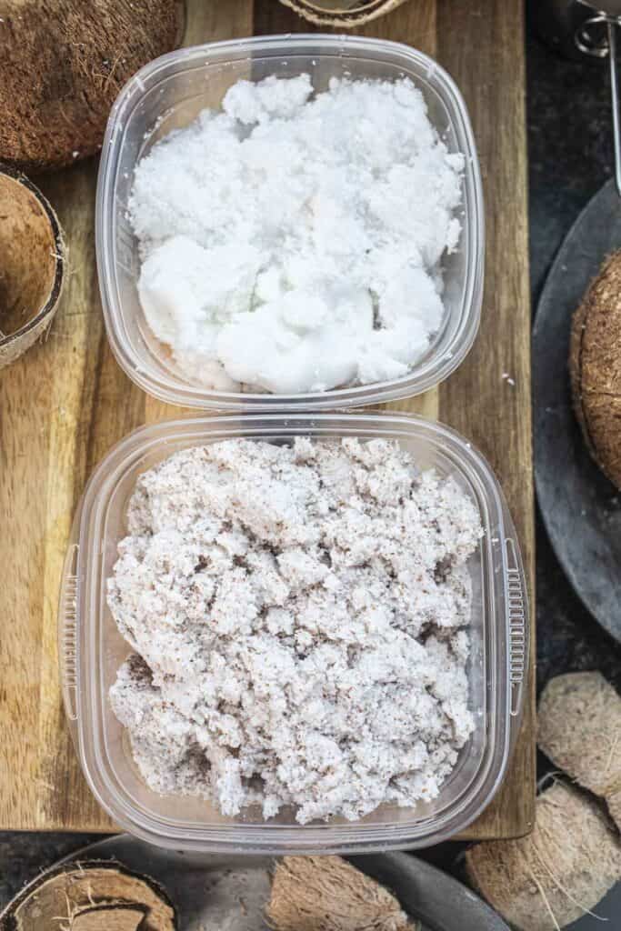 Coconut pulp in containers on cutting board. 