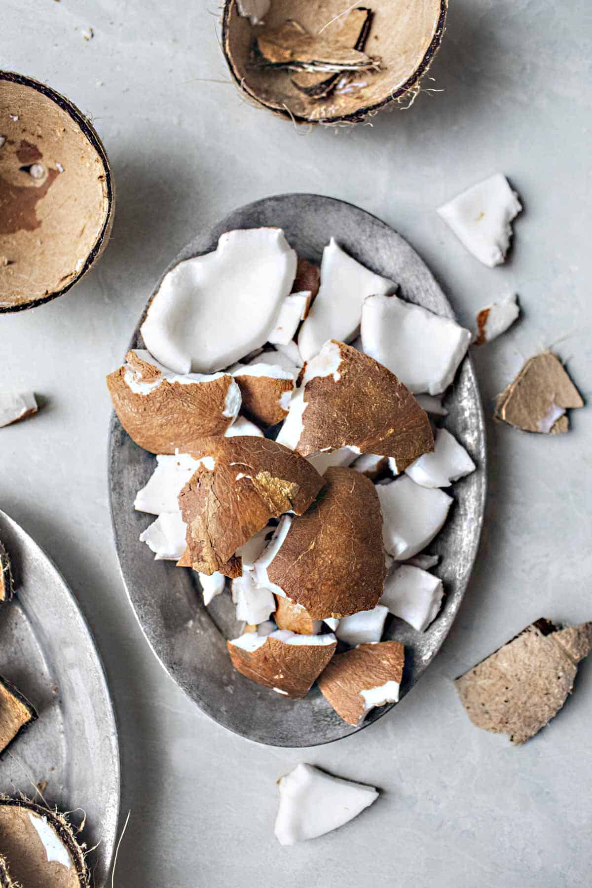 Coconut meat on a plate on the table. 