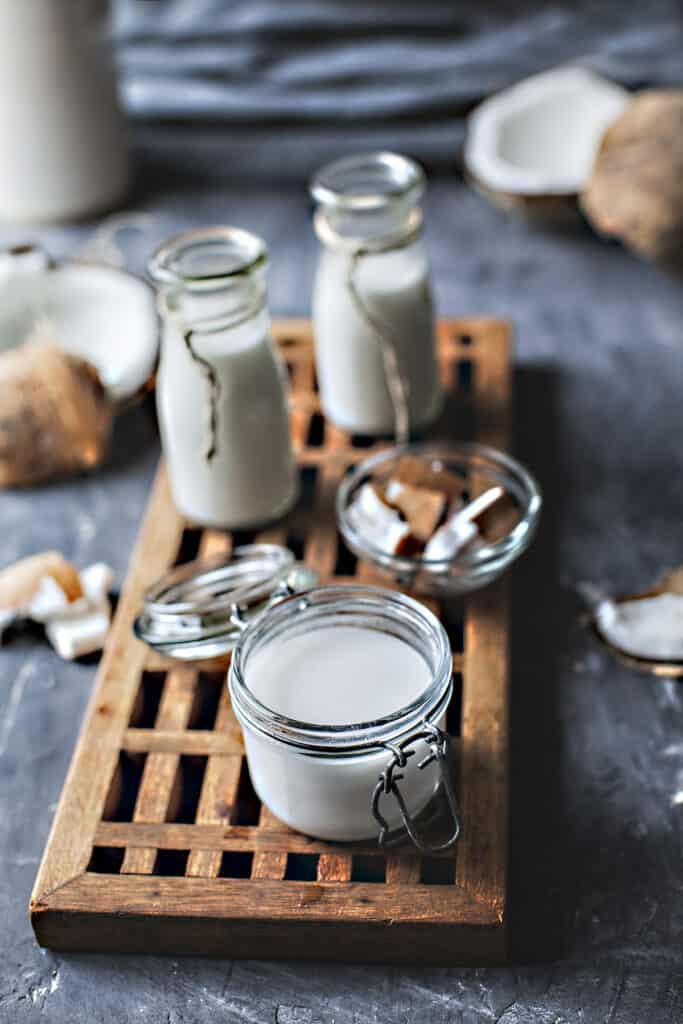 Fresh coconut milk in glasses on the table.