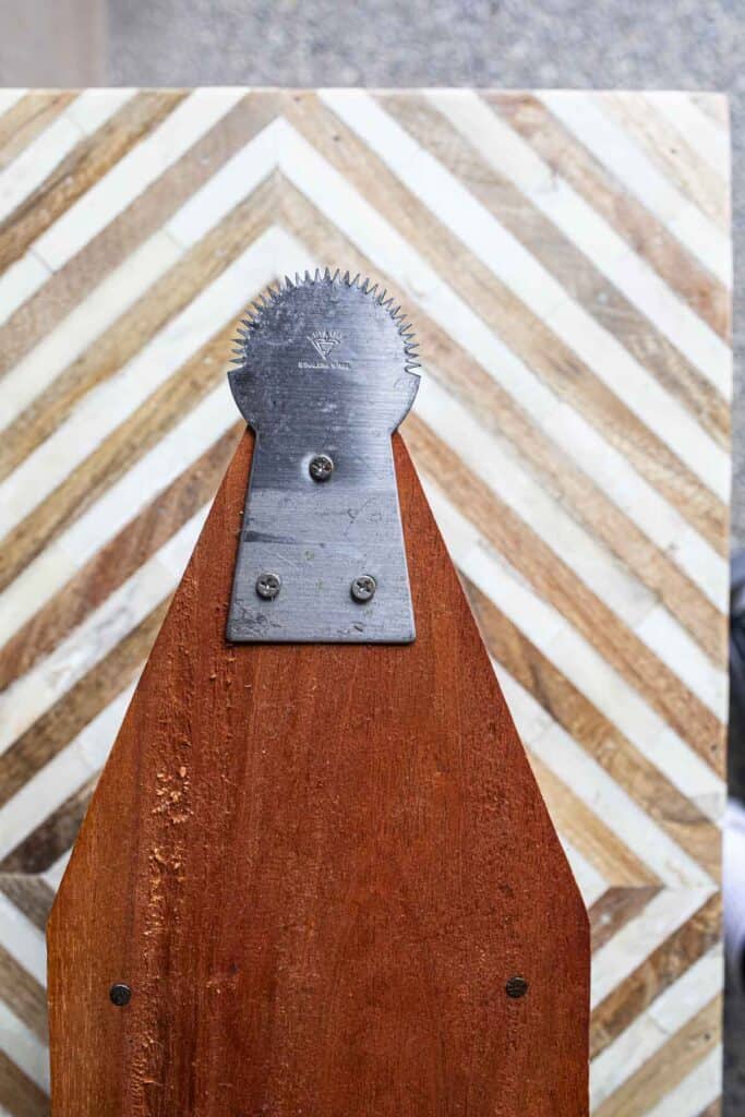 Jaggery edges of Traditional Thai Coconut grater on a table. 