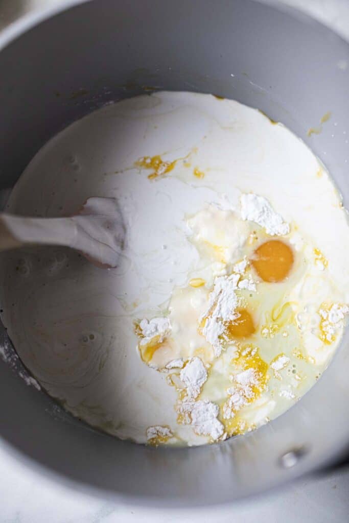 Egg and milk mixture in a pot. 