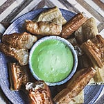 pandan custard in a bowl with donuts.