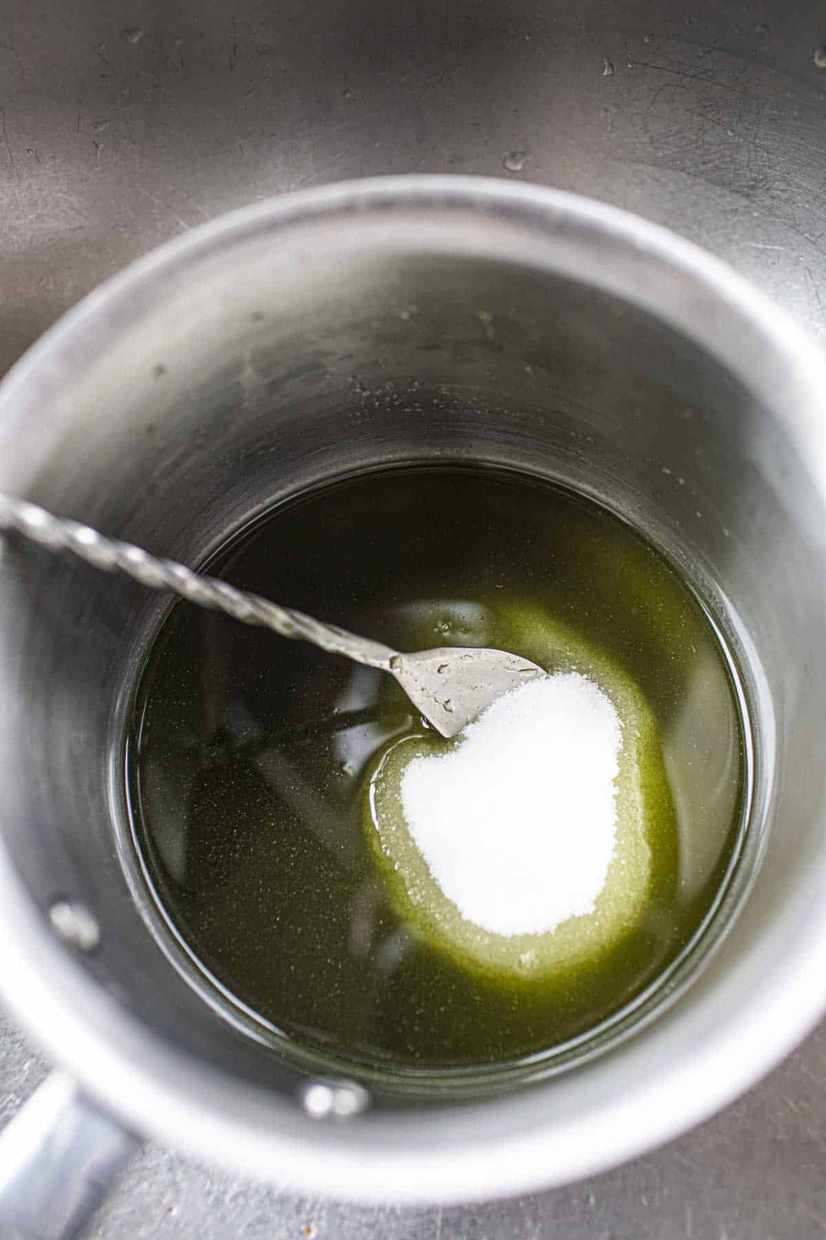 Pandan juice and sugar in stock pot.