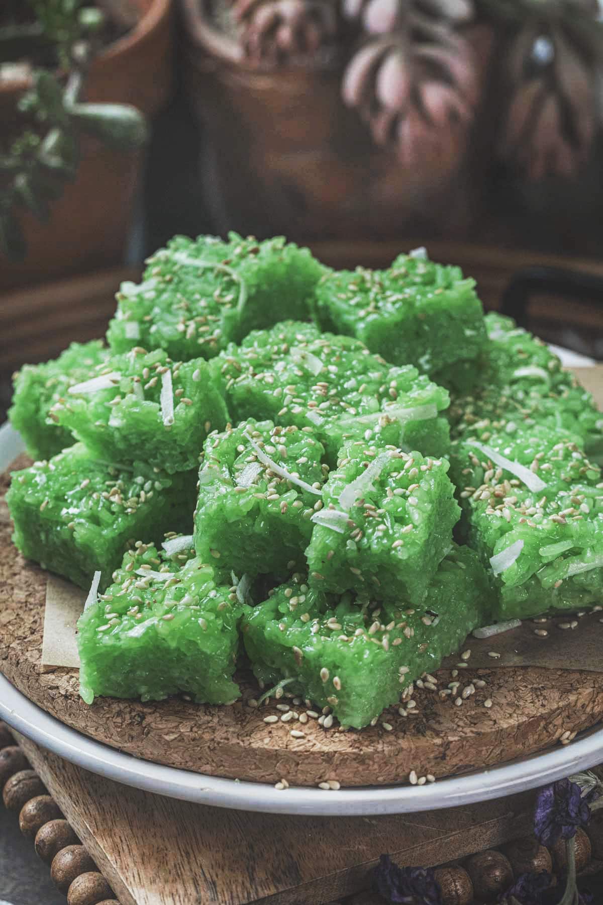 Pandan coconut sticky rice in cubes on a tray.