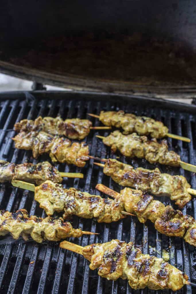 cooked pork skewers on a grill. 